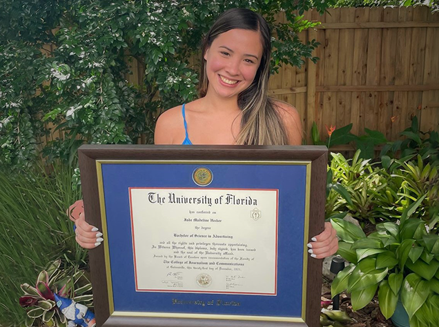 Girl holding a University of Florida Diploma Frame