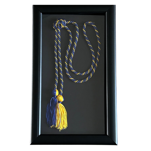 blue and gold honor cords in shadow box frame