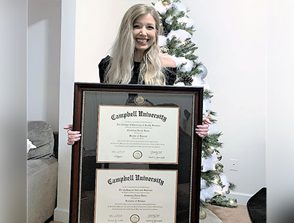Happy girl gifted holiday present for double document diploma frame