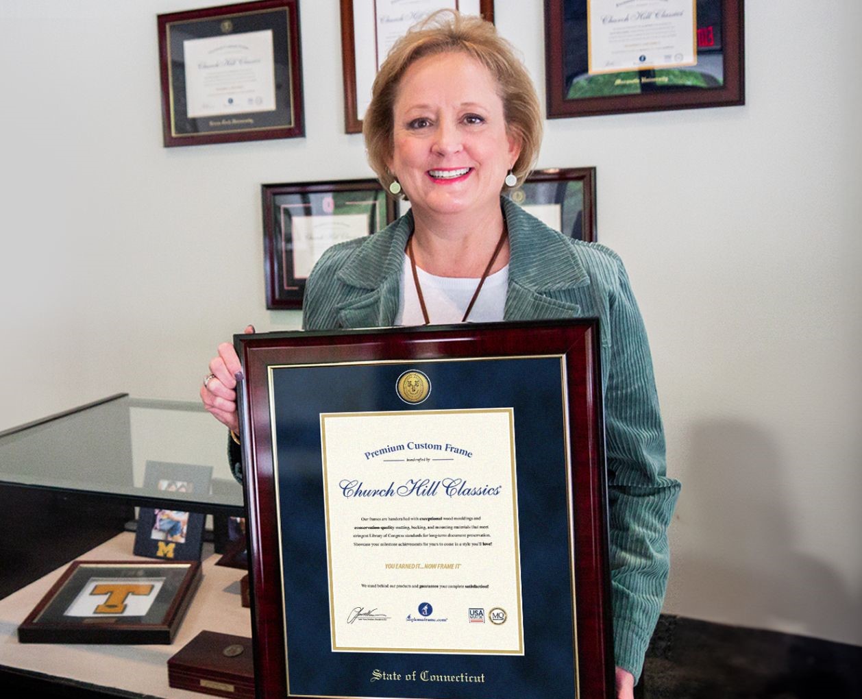 Lucie Voves holding State of Connecticut license frame