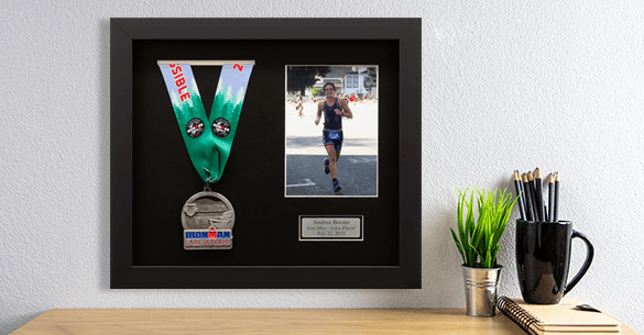 Specialty frame, marathon medal frame, which features a medal and a photo of the runner on a white wall.