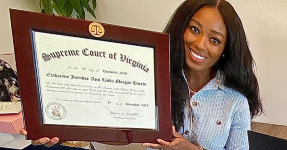 smiling, African American girl holding her Supreme Court of Virginia professional frame.