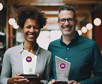 Two people smiling holding customized recognition products