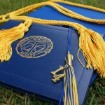 graduation cap, tassel, and diploma