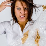 woman-struggling-with-packaging