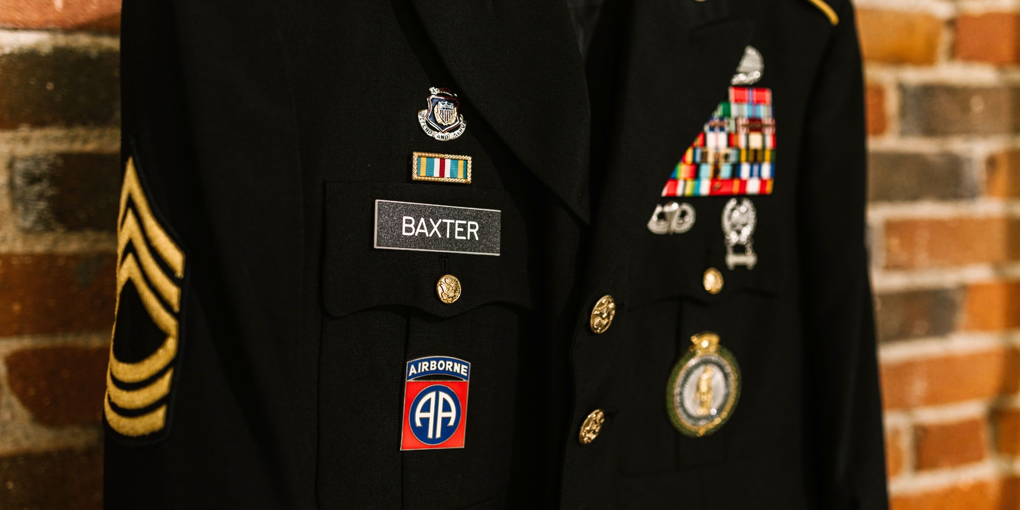 military coat decorated with various awards and nametag Baxter