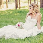 woman in wedding dress outside on grass