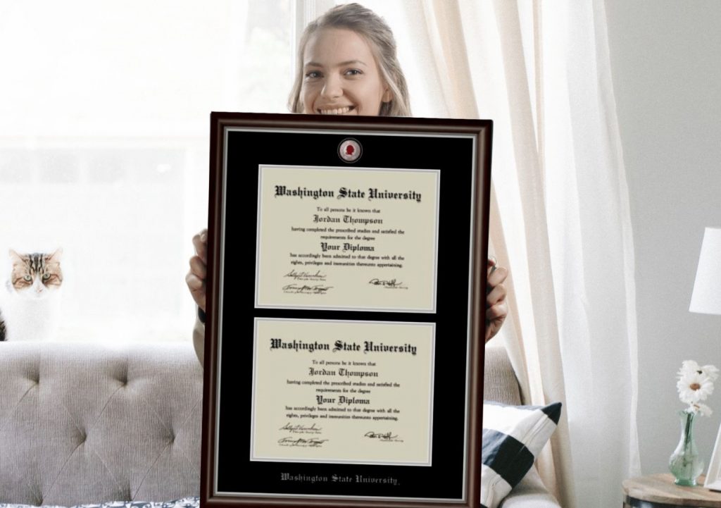 girl holding washington state university double diploma frame