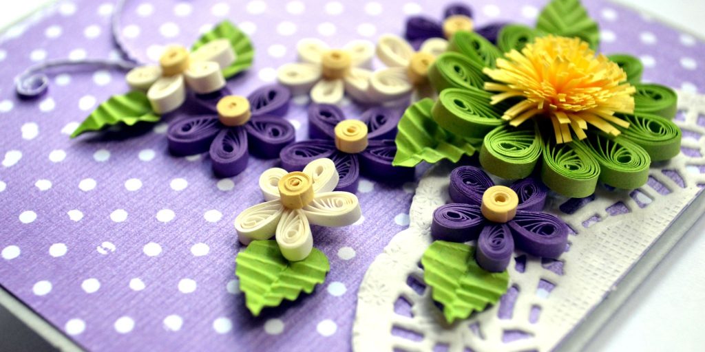 closeup of quilled paper flowers on homemade card