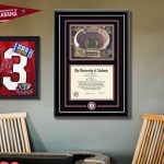 game room with unversity of alabama memorabilia, diploma frame, and shadow box on wall