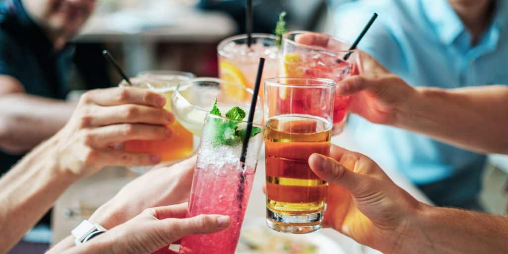 group of people cheersing alcohol