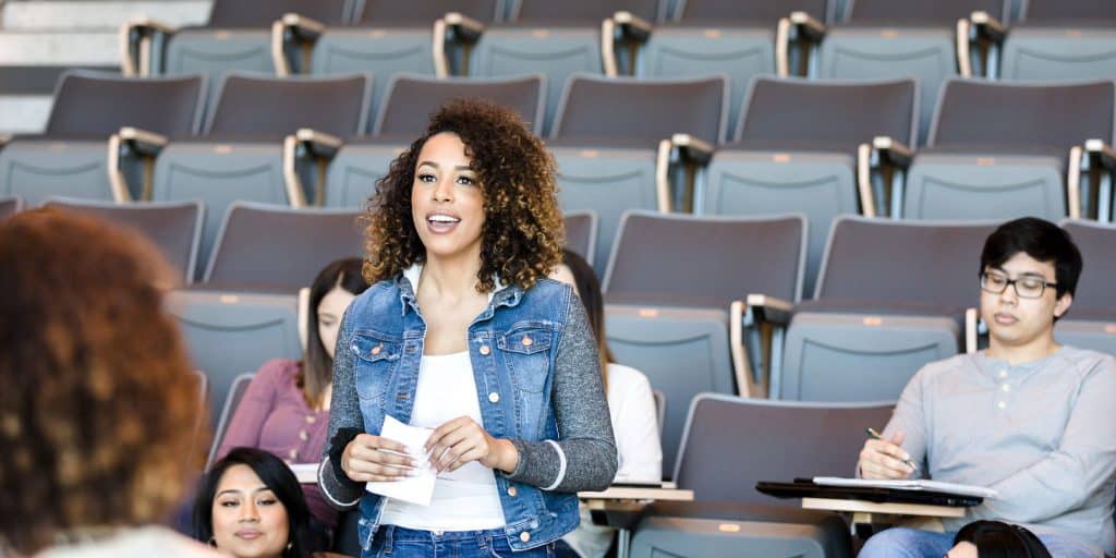 confident student giving presentation