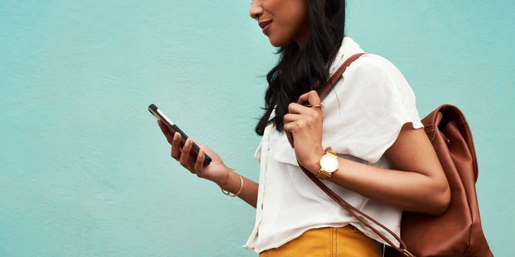 female student looking at cell phone