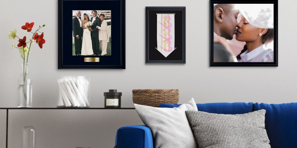 wedding photos and framed keepsakes on wall