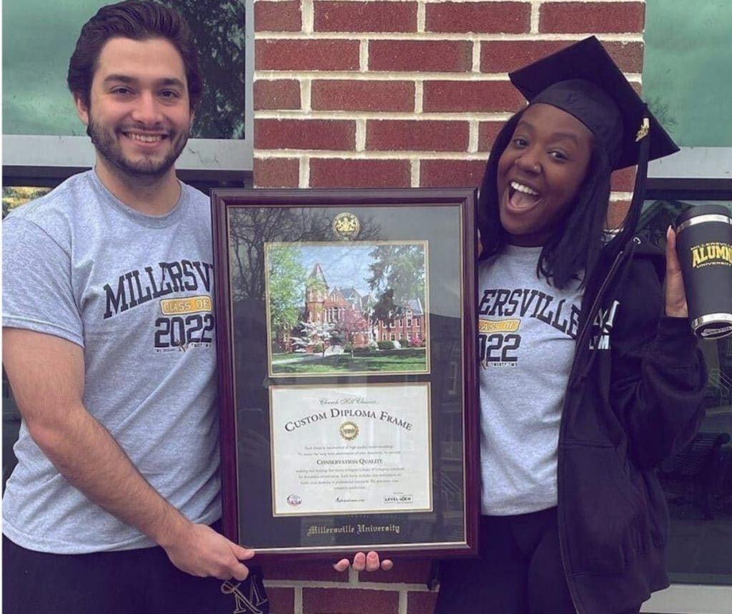 millersville grads with diploma frame