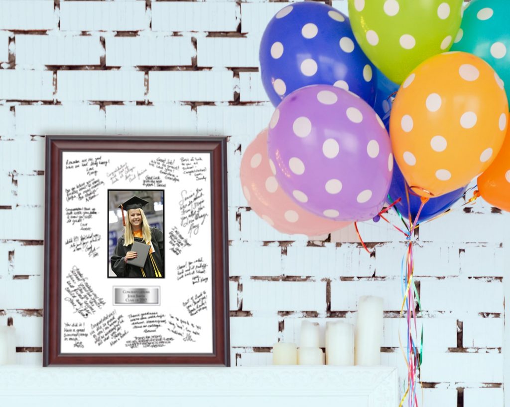 autograph frame with photo of graduate next to colorful balloons