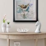 watercolor painting of seagull on wall above table