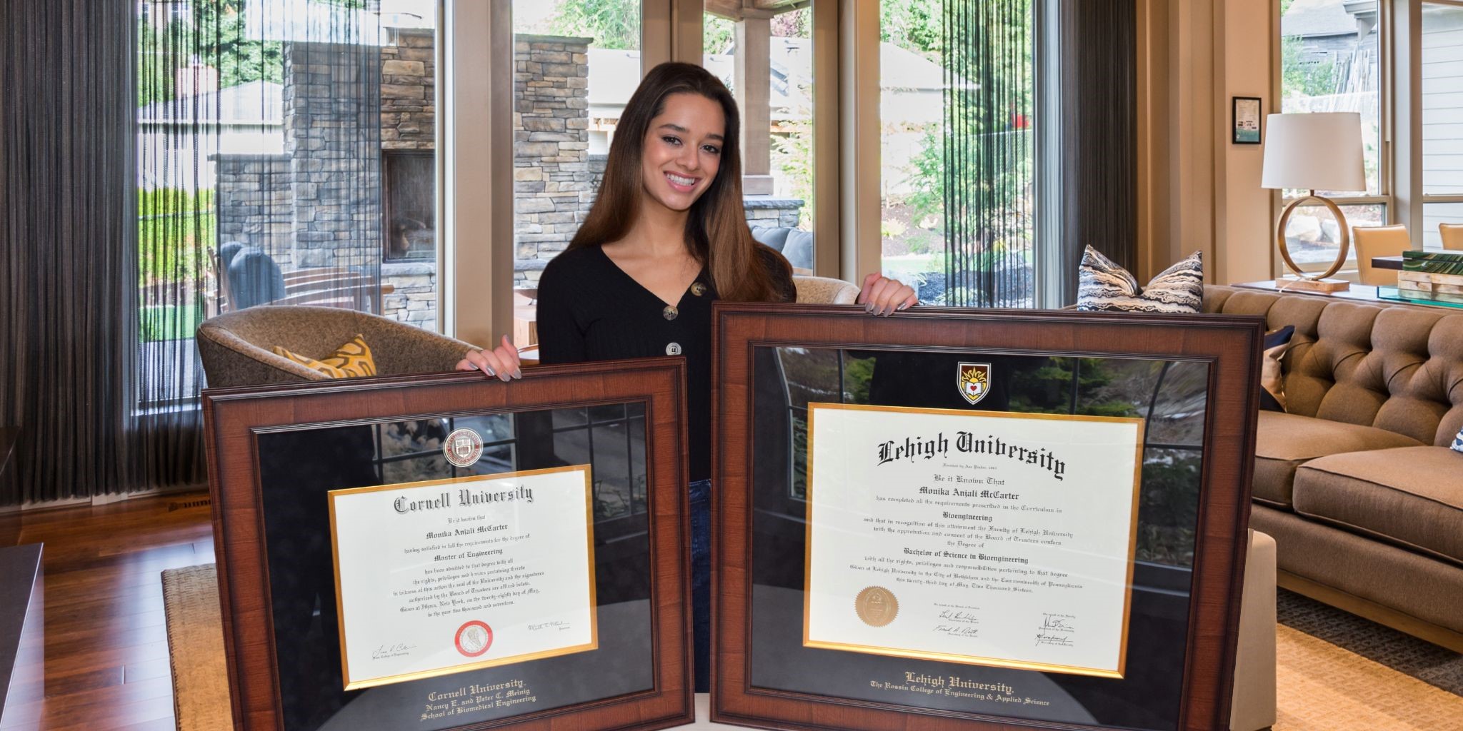 young woman holding her cornell frame and lehigh frame