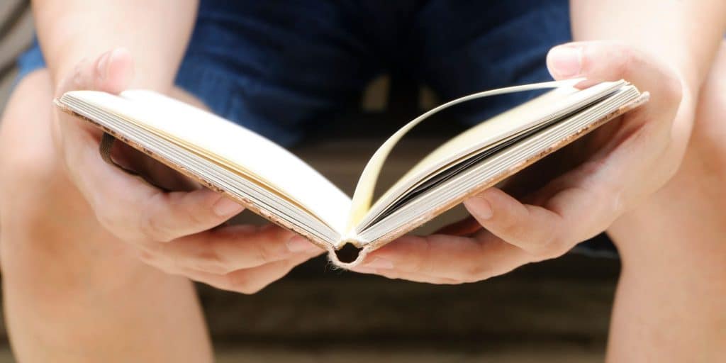 hands reading book