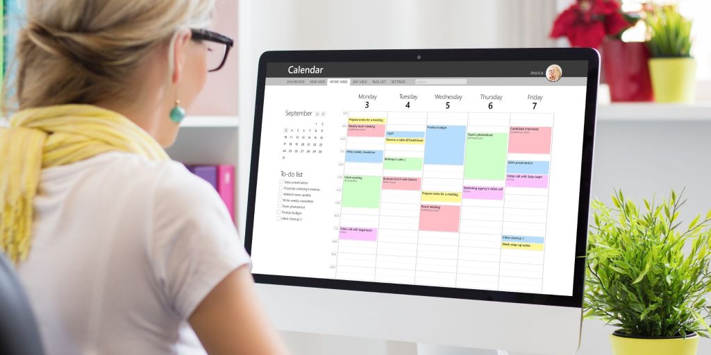 woman viewing calendar on her laptop screen