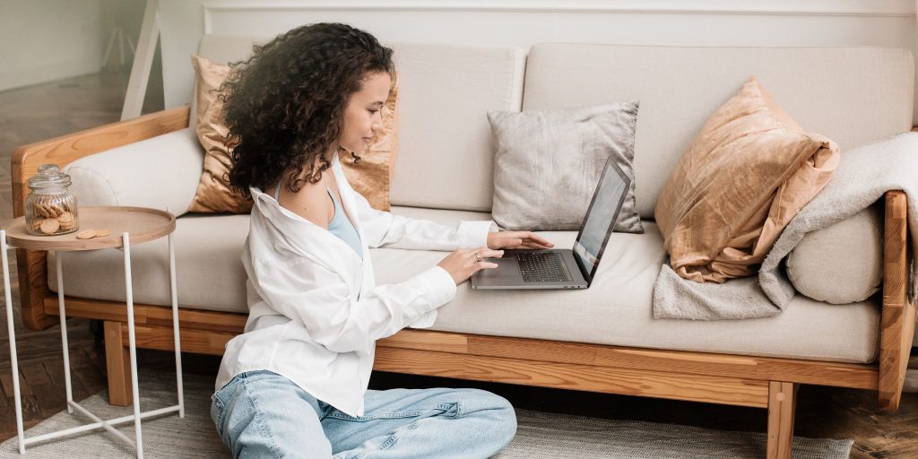 woman working on laptop from living room