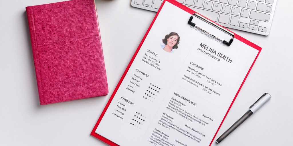 closeup of resume on red clipboard