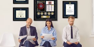 job applicants in waiting room with Inc Award and certificate frames on wall