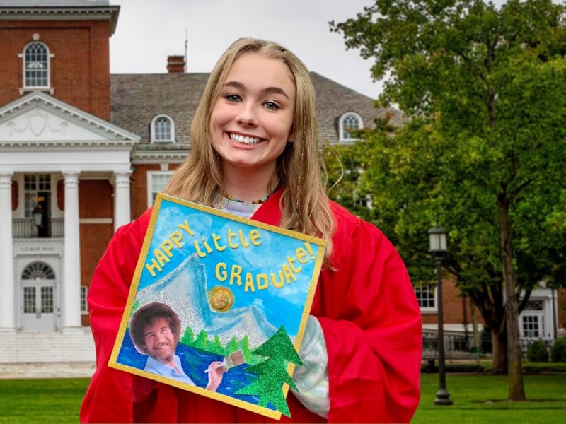 girl holding her decorated grad cap