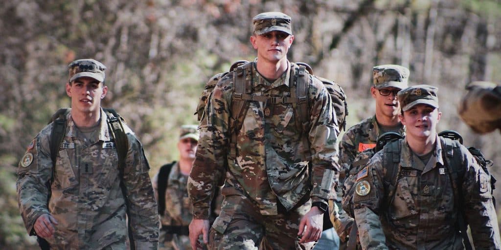 group of army soldiers walking in uniform