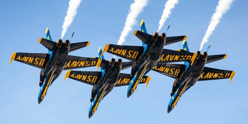 four US navy planes flying in formation