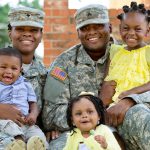 military husband and wife with three kids