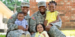 military husband and wife with three kids