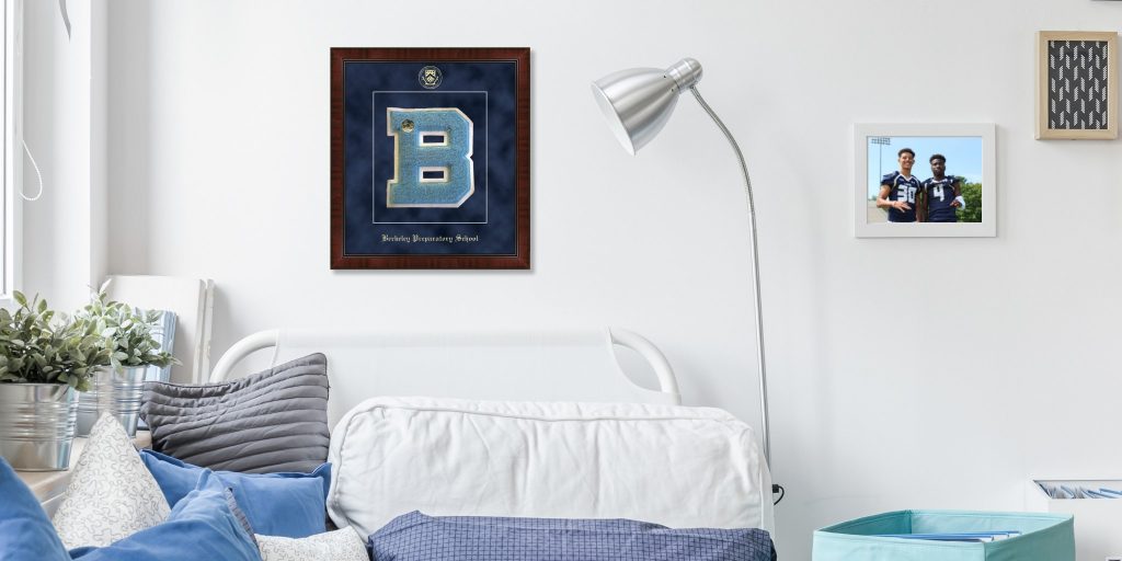 custom varsity letter frame and photo frame on wall above bed in bedroom