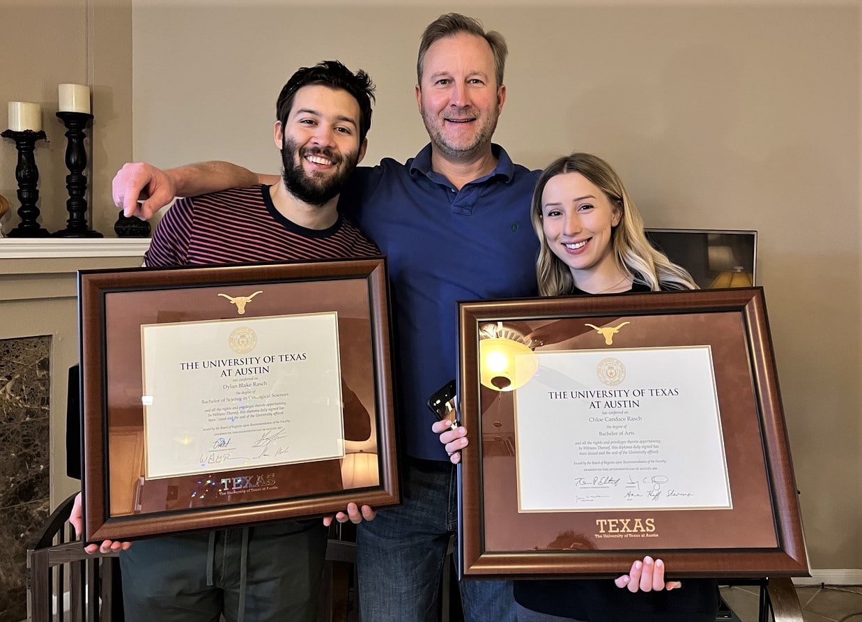 dad with kids holding ut austin frames