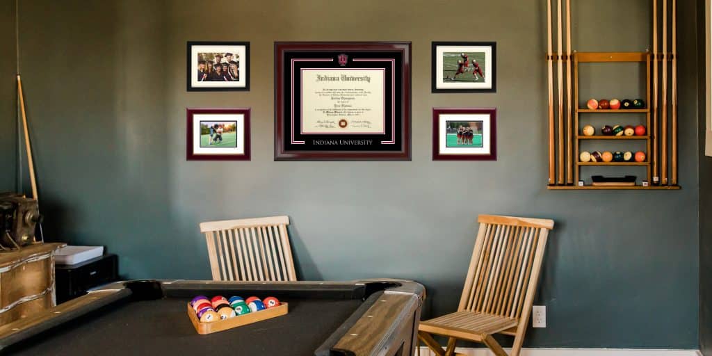 IU diploma frame and photo frames hanging above pool table