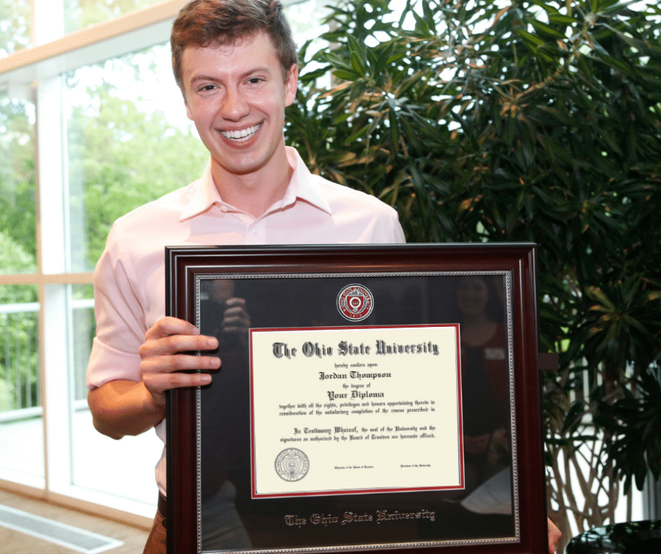 senior holding ohio state diploma frame