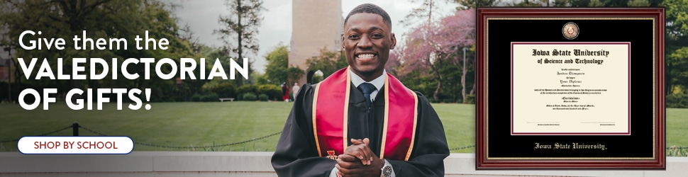 smiling iowa state university grad next to diploma frame