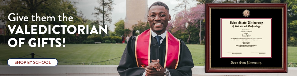 smiling iowa state university grad next to diploma frame banner