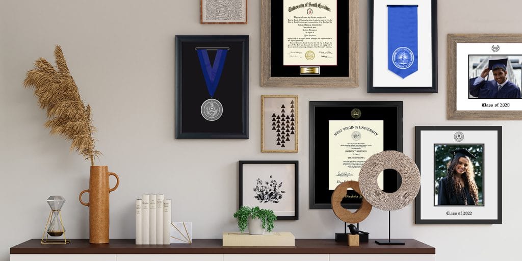 gallery wall display in home with honors medallion shadow box and diploma frames