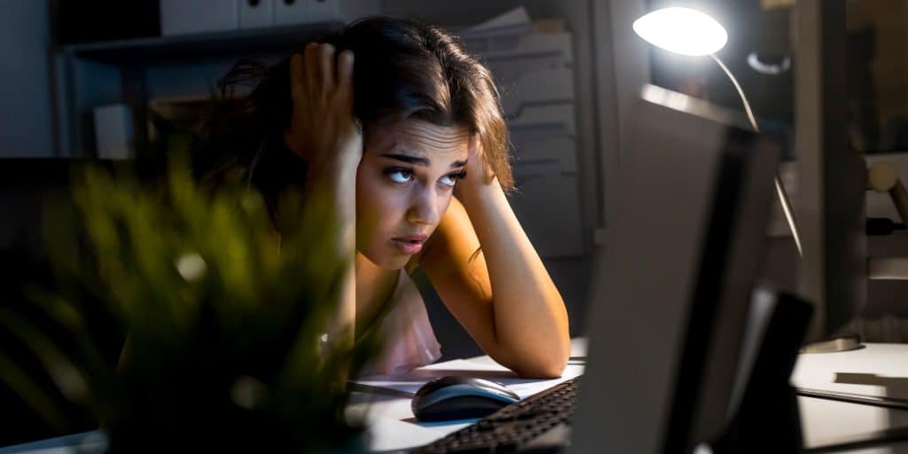 student working late on laptop