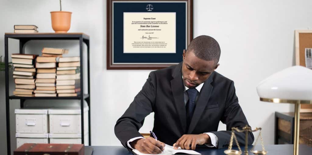 lawyer in office with law logo frame on wall