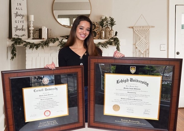 Graduated with her two diploma frames