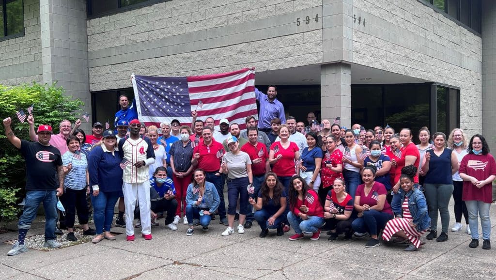 Church Hill Classics employees with American flag