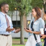 college tour guide talking to students