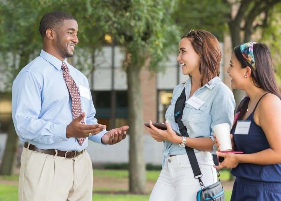 college tour guide talking to students
