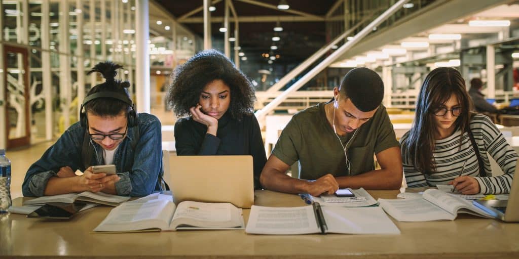 college students studying at library