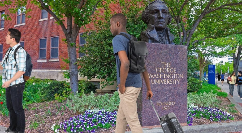 students near gwu statue