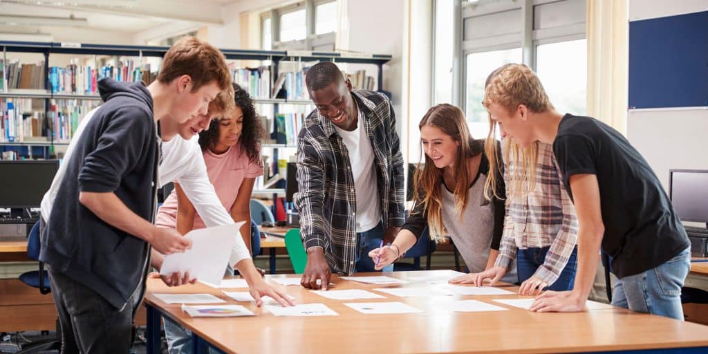 students doing group project over table