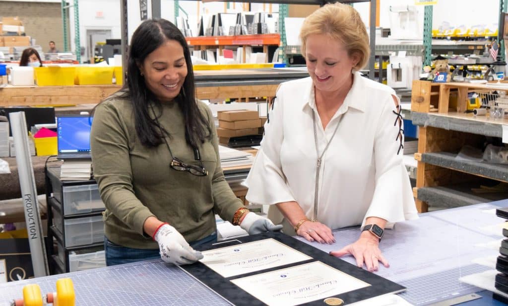 julia and lucie inspecting double mat