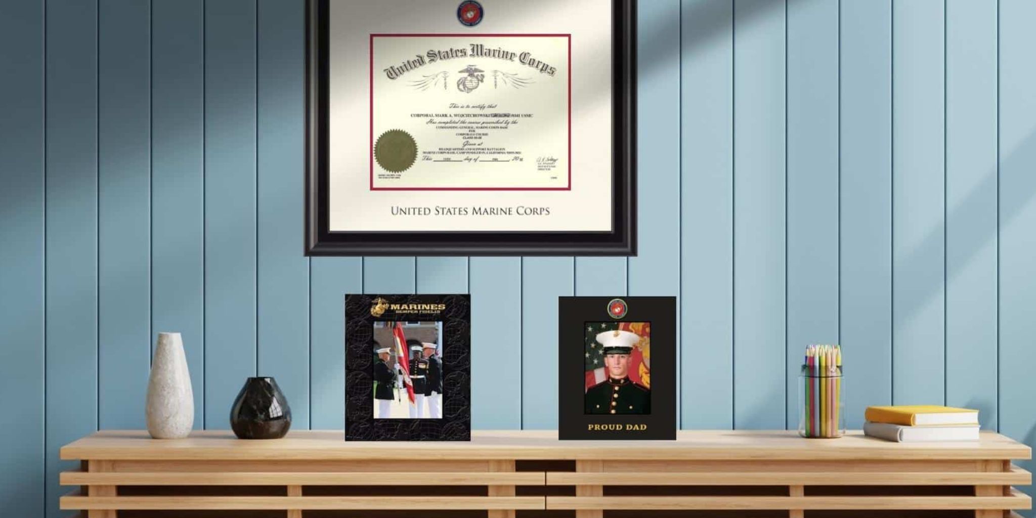 US Marine Corps certificate frame and USMC photo frames in living room
